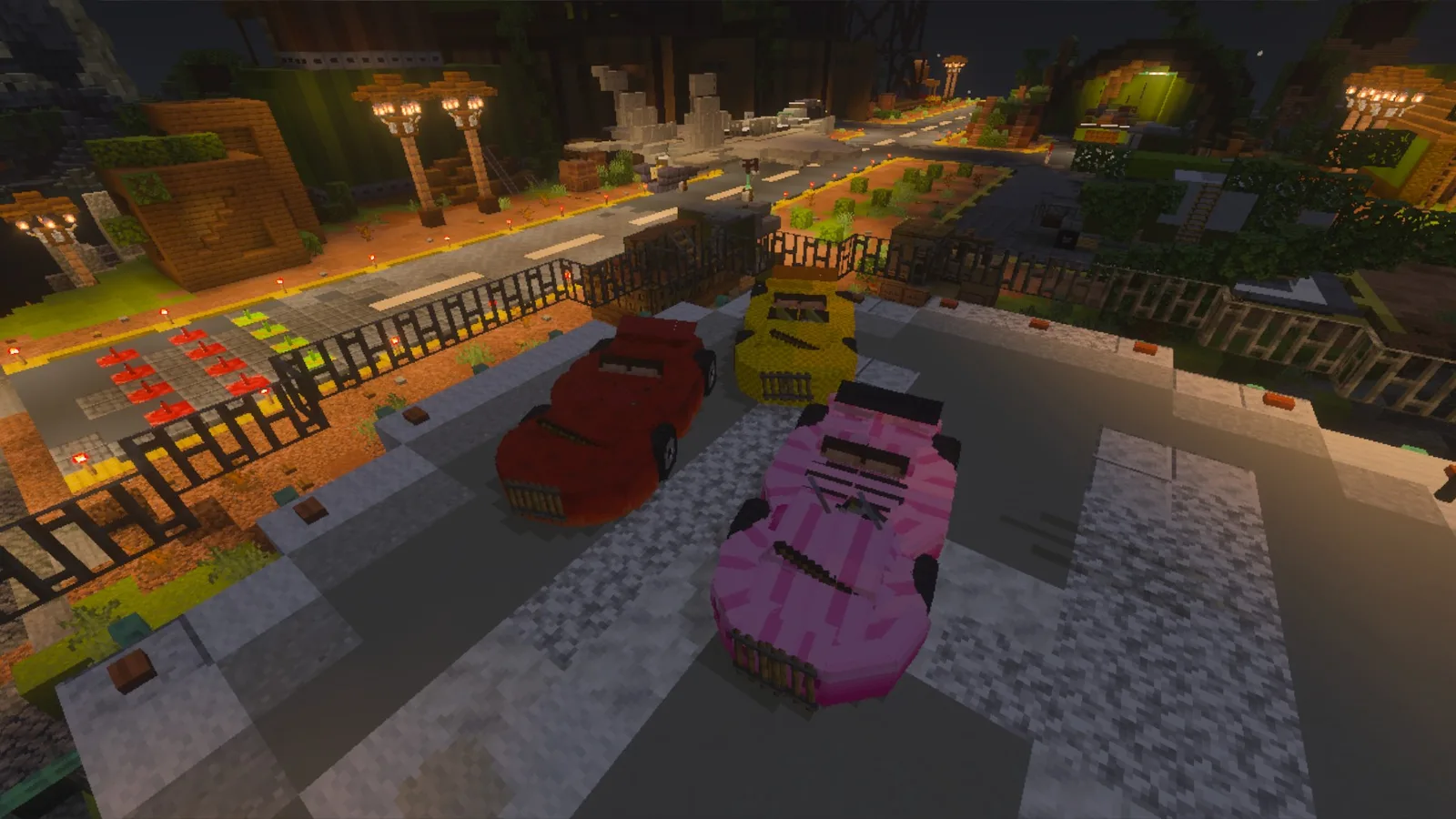 A red, a yellow and a pink car parked on a road in the KiwiSMP lobby, seen on Bedrock