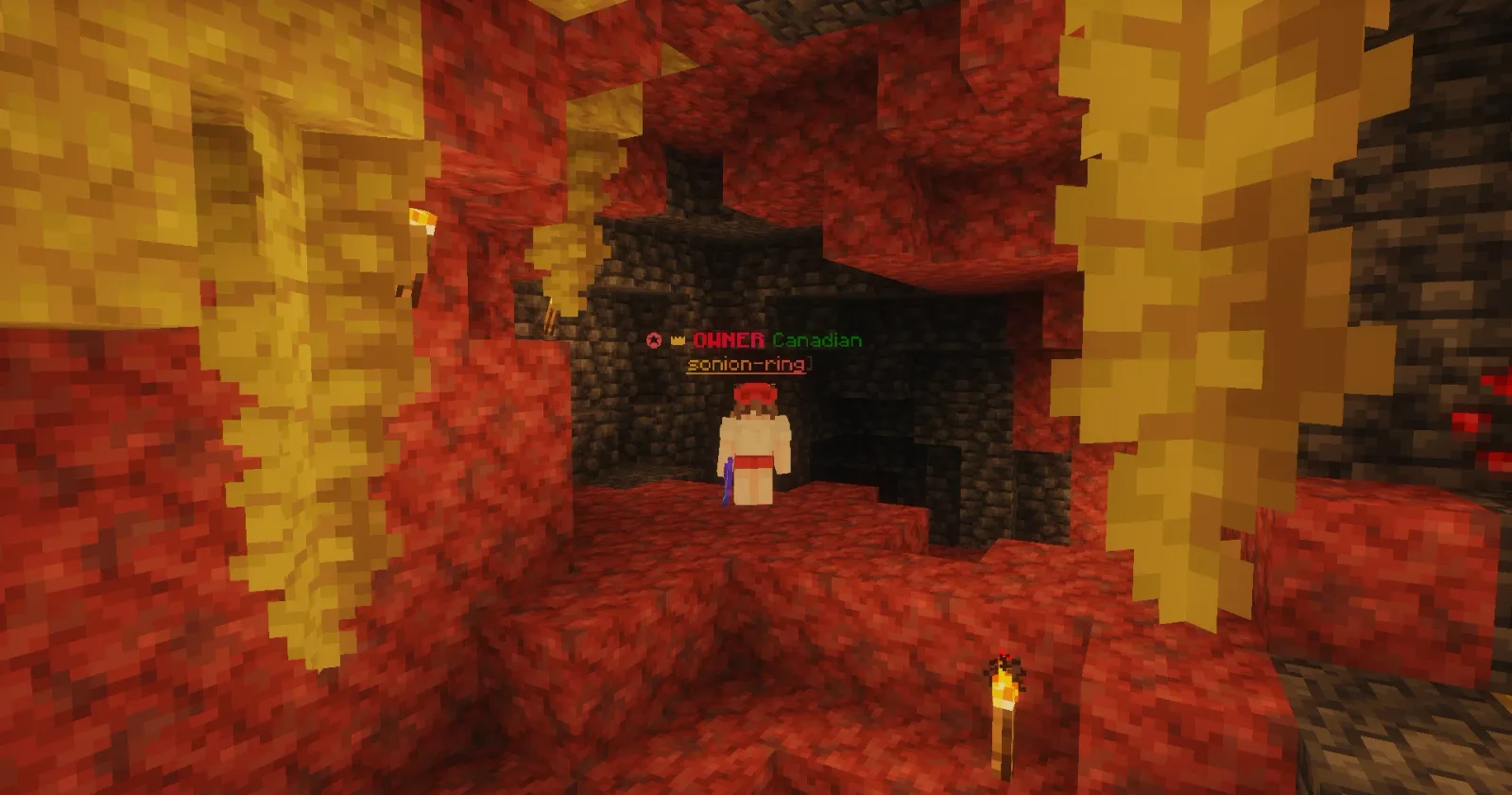 Canadian exploring a red and yellow sulfur cave